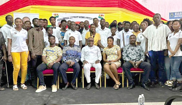 Kwesi Bonzoh (seated middle), Ellembelle  DCE, with the beneficiaries after the ceremony