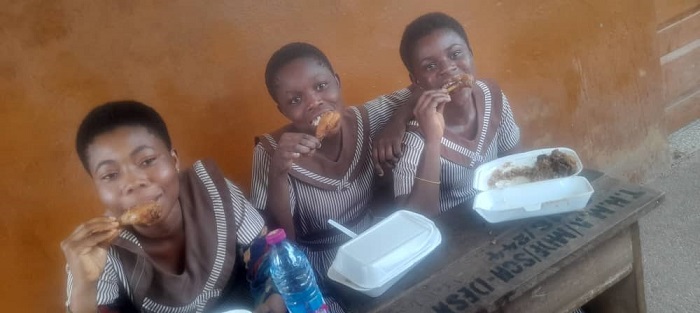 Candidates of the Dadwen  JHS  enjoying their  meals after  the last  paper.