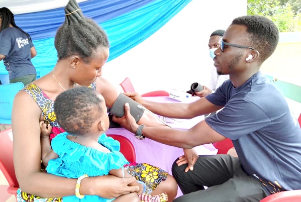 Elizabeth Mensah (left),  a resident of Komenda, being screened during the exercise