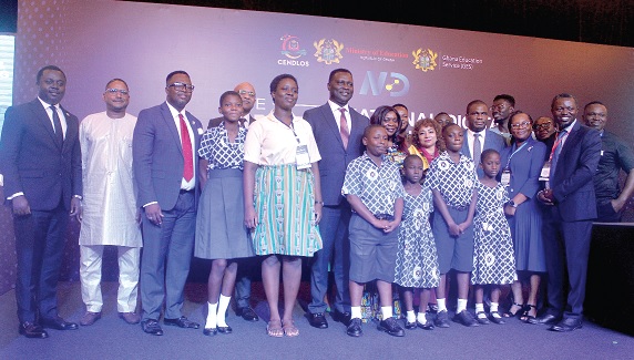 Dr Yaw Osei Adutwum (arrowed), Minister of Education; John Ntim Fordjour (left), Deputy Minister of Education; Nana Gyamfi Adwabour (3rd from left), Executive Director, Centre for National Distance Learning and Open Schooling, with other dignitaries and schoolchildren at the launch in Accra.  Picture: ESTHER ADJORKOR ADJEI