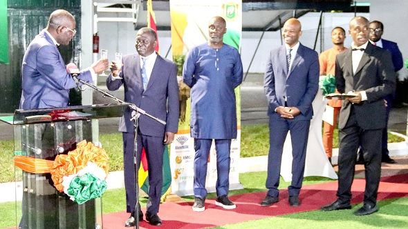 Assielou Felix Tanon (left), Ivorian Ambassador to Ghana, proposing a toast with Benito Owusu-Bio (2nd from left), a Deputy Minister of Lands and Natural Resources. With them are some officials of the Ivorian Embassy. Picture: ERNEST KODZI