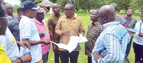 Ekow Sampson (middle), Deputy CEO, GTA, explaining a point to Nana Awuku (left), a contractor, after handing over the site to him. Looking on is Akwasi Agyeman (right), CEO, GTA