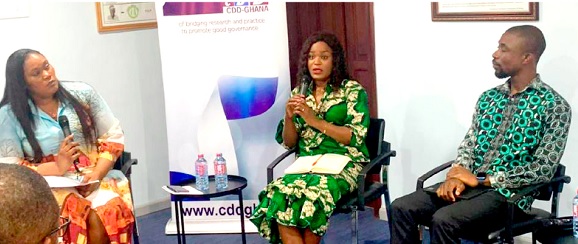 Dr Rita Udor (middle), Gender Inclusivity Officer at the Kwame Nkrumah University of Science and Technology, making a point during the panel discussion. With her is Selaseh Pashur Akaho (right), a Statistician at the Ghana Statistical Service, and Animwaa Anim Addo (left), the moderator