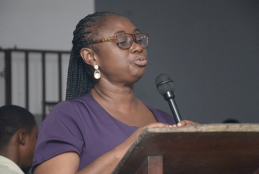 Janet Sarney-Kuma (left), Director of Capacity Development and Outreach of the National Peace Council, addressing the students