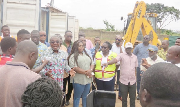 Dr Anthony Nsiah-Asare (arrowed), Presidential Advisor on Health, addressing the people at the site