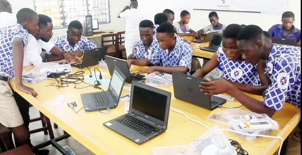 Some pupils and students studying in the ICT laboratory