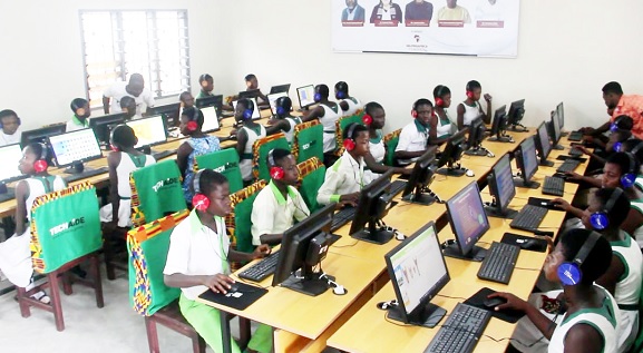 Some pupils and students studying in the ICT laboratory