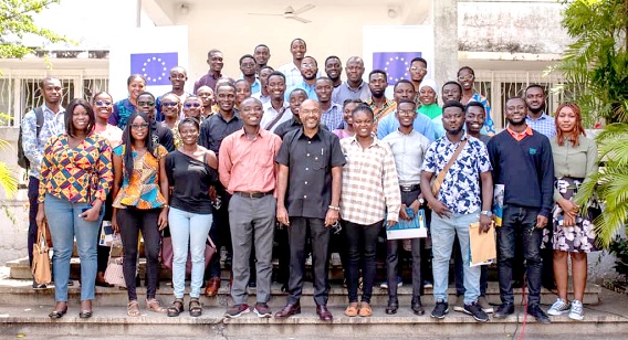 Irchad Razaaly (middle), EU Ambassador to Ghana, with the beneficiaries after the pre-departure ceremony