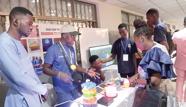Some students of the Pentecost University explaining to participants how some engineering technologies work during an exhibition. Picture: EDNA SALVO-KOTEY