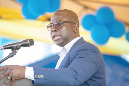 Dr Yaw Perbi (inset), Global Chief Executive Officer of HuD Group, addressing last Saturday's Speech and Prize-giving Day at the Ridge Church School