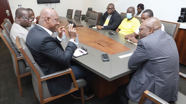 Ato Afful (left), Managing Director, GCGL, briefing Philip Owiredu (right), Managing Director, CalBank, about the Graphic brand at a meeting at the head office in Accra. Picture: SAMUEL TEI ADANO