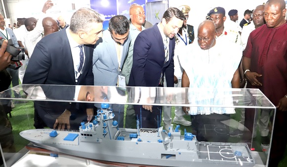 Deniz Yilmaz (3rd from right), African Regional Manager, Aselsan, briefing  President Akufo-Addo (3rd from left) about one of the Navy ships built by the company. With them are staff of the company.Picture: SAMUEL TEI ADANO