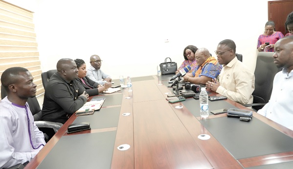Fifi Fiavi Kwetey (2nd from right), General Secretary of the NDC, speaking at the meeting, while Albert Kwabena Dwumfour (2nd from left), President of GJA, and some executive members of the association look on.  Picture: EDNA SALVO-KOTEY