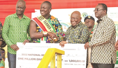 FLASHBACK: President Nana Addo Dankwa Akufo-Addo (2nd from right) being supported by Dr Owusu Afriyie Akoto (right), Minister of Food and Agriculture, to present the award to Nana Yaw Sarpong Siriboe, 2022 National Best Farmer
