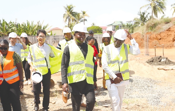 Ken Ofori-Atta (right), the Minister of Finance, and his team being conducted aroud the site