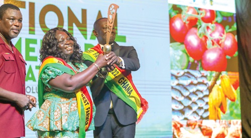 Charity Akortia, 2023 National Best Farmer, receiving the award symbol from Nana Siriboe I, 2022 National Best Farmer