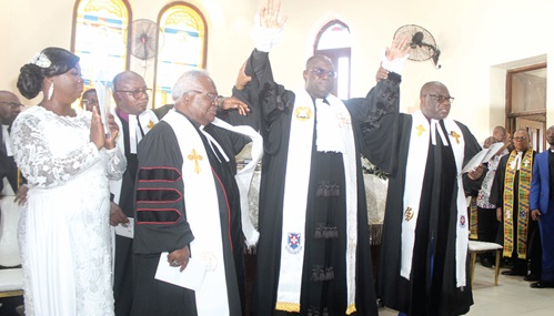 Very Rev. Prof. Joseph Obiri Yeboah Mante (right), immediate past Moderator of the Presbyterian Church of Ghana, and Very Rev. Prof. Emmanuel Martey (2nd from left), former Moderator of the church, introducing Rt Rev. Dr Abraham Nana Opare-Kwakye (2nd from right), Moderator, Presbyterian Church of Ghana, after the induction service. With them is Benedicta Kwakye (left), spouse of the Moderator. Picture: ESTHER ADJORKOR ADJEI