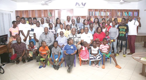 Executive of Afriwave Telecom with some of the children of Teshie Orphanage