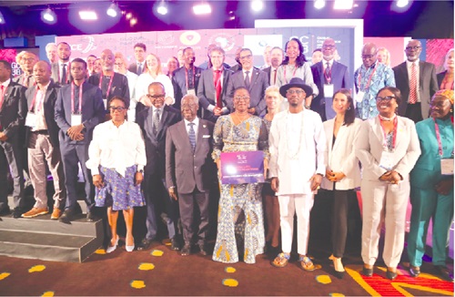 Yaw Osafo-Maafo (6th from right), Senior Presidential Advisor; Ursula Owusu-Ekuful (5th from right), Minister of Communications and Digitalisation; Dr Albert Antwi-Boasiako (2nd from left), Director-General, Cyber Security Authority, with other guests after the opening session of the Cyber Security Global Conference in Accra. Picture: SAMUEL TEI ADANO