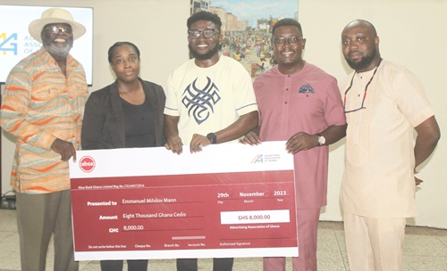 Francis Dadzie (left), Executive Director, Advertising Association of Ghana, presenting a dummy cheque to Emmanuel Mihilov Mann (middle), winner of the AAG Logo Competition. With them are Andrew Ackah (2nd from right), President of the Advertising Association of Ghana; Clarence Amoatey (right), Vice President of AAG; and Sharon Mills (2nd from left), Council Member of AAG Francis Dadzie (left), Executive Director, Advertising Association of Ghana, presenting a dummy cheque to Emmanuel Mihilov Mann (middle), winner of the AAG Logo Competition. With them are Andrew Ackah (2nd from right), President of the Advertising Association of Ghana; Clarence Amoatey (right), Vice President of AAG; and Sharon Mills (2nd from left), Council Member of AAG