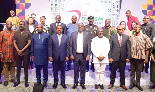 Ken Ofori-Atta (3rd from right, front row), Minister of Finance; Dr Ibrahim Awal (4th from right), Minister of Toursim, Arts &amp; Culture, and some invited guests after the opening session of the Ghana Tourism Investment Summit in Accra. Picture: EMMANUEL QUAYE
