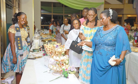 Efua Otua Goode Obeng Kyei (right), Director of the EKGS Culinary Institute, leading the other invited guests to inspect the work of the graduands