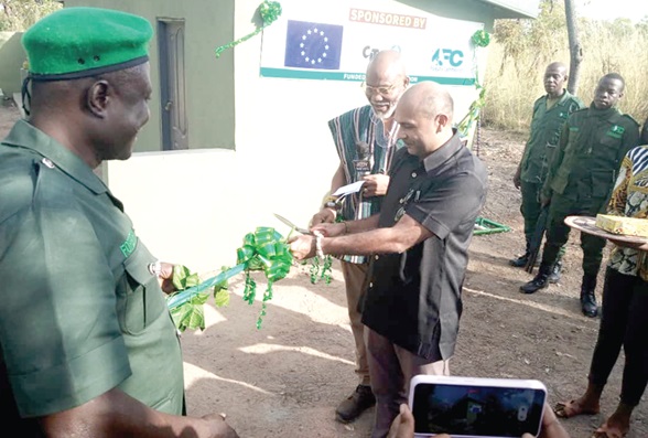Irchad Razaaly (middle), EU Ambassador to Ghana, being supported by Iddrisu Musah (right), Deputy Chief Executive Officer of the Forestry Commission, and Ali Mahama (left), Mole National Park Manager, to inaugurate the facilities 