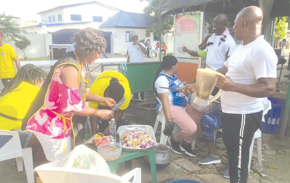 Members of the club cooking during the competition