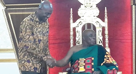 Dan Botwe (left), Minister of Local Government, Decentralisation and Rural Development, exchanging pleasantries with Okyenhene, Amoatia Ofori Panin Osagyefuo, at his palace
