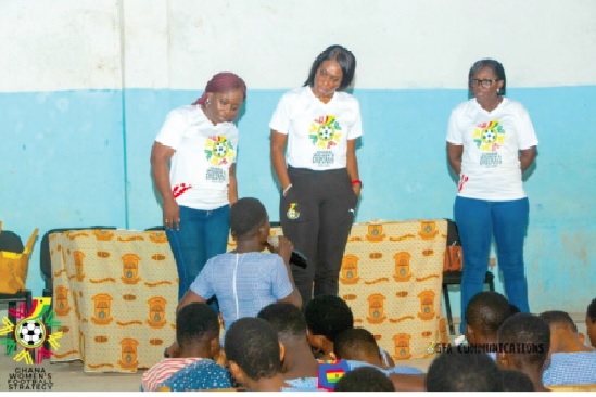 • Ama Brobey-Williams (middle), head of the Women’s Football Department of the GFA, flanked by Evelyn Nsiah-Asare and Winifred Mawudeku (left), as they interact with students of Bolgatanga SHS.