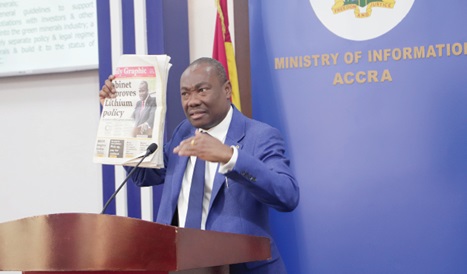 Martin Kwaku Ayisi, Chief Executive Officer, Minerals Commission, using a Daily Graphic report to buttress a point on the Lithium policy during the media briefing. Picture: EDNA SALVO-KOTEY
