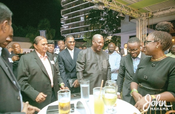 John Mahama interacting with some business executives at the dinner in Accra