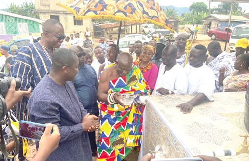 Barima Okogyeabusua Banning Duodu (arrrowed), the Anyinamhene, drinking water fetched from the mechanised borehole