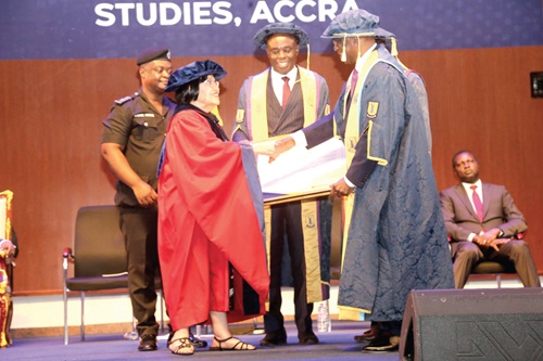 Kofi Konadu Sarpong (right), Chancellor, UPSA, presenting a citation to Joyce Bamford Addo, a former Speaker of Parliament. With them is Abednego Feehi Okoe Amartey (2nd from right), Vice-Chancellor, UPSA