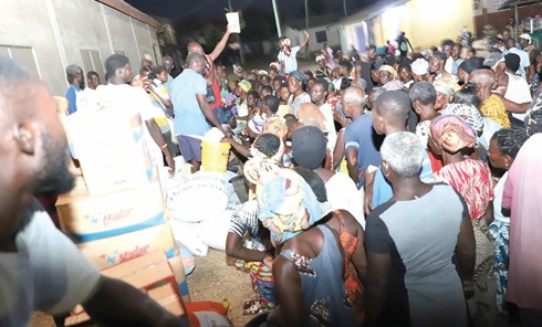 Some of the displaced persons awaiting their share of the items donated by Stephen Adjokatcher. Picture: DELLA RUSSEL OCLOO