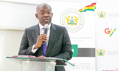 Kojo Oppong Nkrumah (left), Minister of Information, addressing  the participants