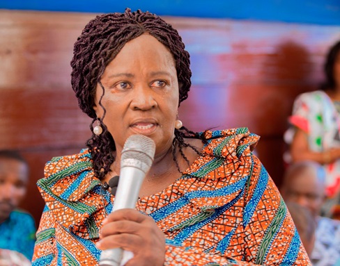 Professor Naana Jane Opoku-Agyemang (left), addressing the market women during the inauguration of the market
