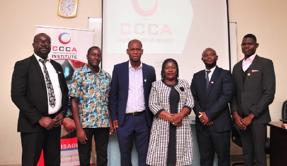 The graduating class with the dignitaries after the event