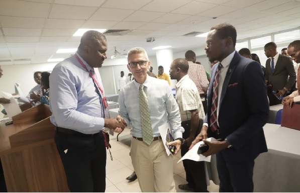 Franklin Sowa, Director of Sales and Marketing of the GCGL (left),  Salah Kweku Kalmoni, Council Member of GREDA (middle) and Isaac Ntiamoah, Marketing Manager of Lakeside Estate interacting after the launch: Photos: EDNA SALVO-KOTEY