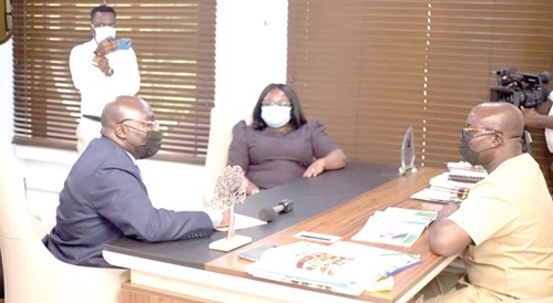 Flash back: Dr Mahamudu Bawumia (left), Vice-President, being briefed by Osei Assibey Antwi (right), Executive Director, NSS, about the digitalisation agenda of the secretariat when Dr Bawumia  visited his office