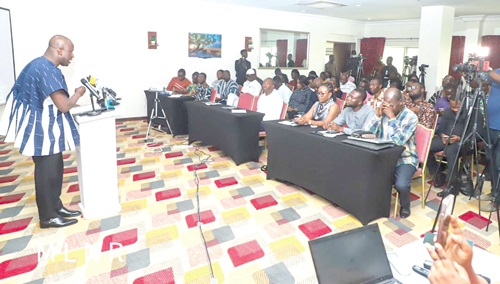 Samuel Abu Jinapor (left), Minister of Lands, addressing the audience at the forum