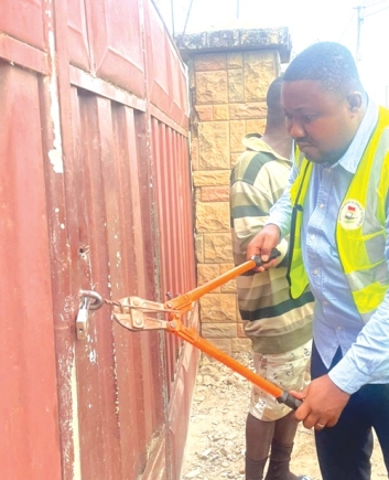One of the rented premises being closed by an official of the GRDA during the exercise
