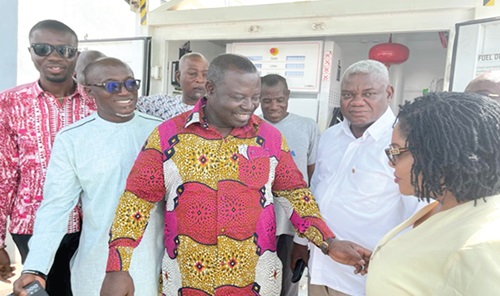 John Osei Frimpong (3rd from left), Chairman of the Select Committee on Food, Agric and Cocoa Affairs,  and MP for Abirem, with some members of the committee during the tour. Right: The automated premix fuel dispensing and monitoring system