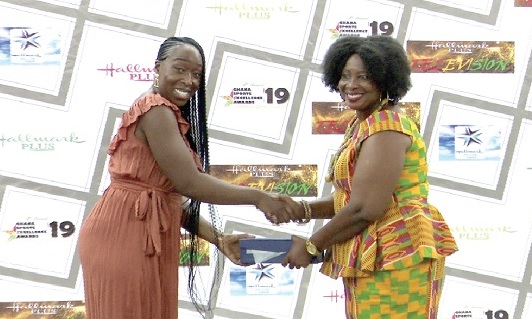 Jeanette Kwakye (left) receiving  the award she won in 2020 from Ms Florence Boateng