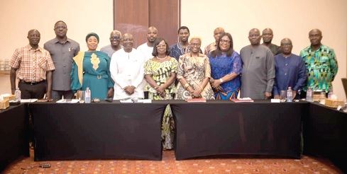 Ken Ofori-Atta (4th from left), Minister of Finance, with some officials after witnessing the signing agreement 