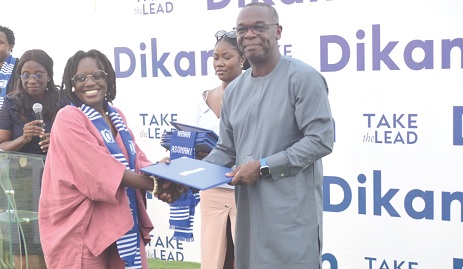 Kofi Kwakwa, Chairman of the Dikan board, presenting a certificate to Norkor Nortey. Pictures: EMMANUEL QUAYE 