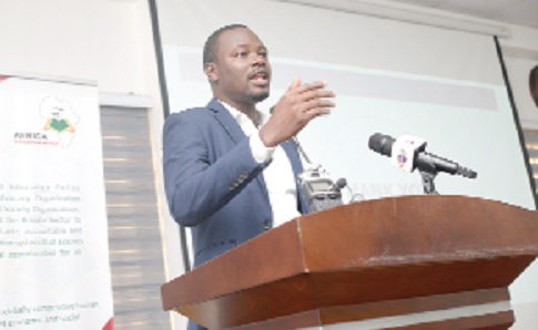 Mr Divine Kpe (inset), Senior Programme Officer, Eduwatch, addressing the participants