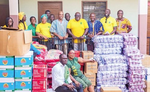 An artist’s impression of the teachers’ residential block at the Ho Mawuli School INSET: Richard Buthelezi Nyarko, President of OMSU, and some members of the union with members of the Mepe Development Association after the donation