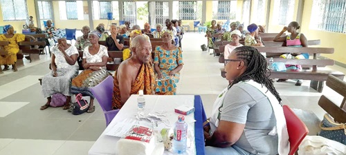 A health worker attending to a client