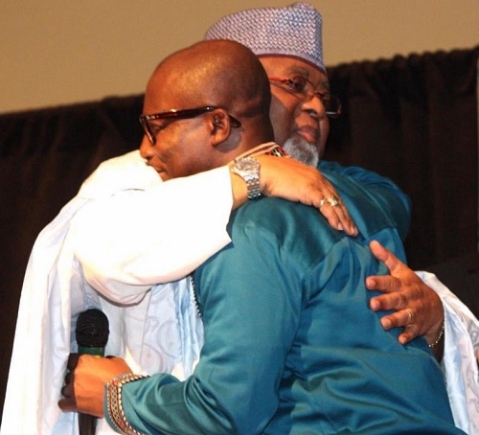 Dr. Kwame Boakye-Danquah in a warm embrace with  Lieutenant General Joseph Henry Smith 
